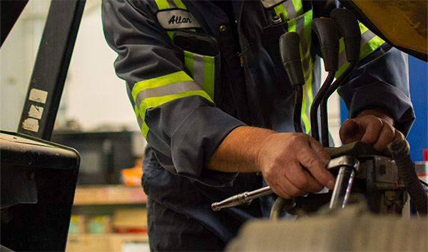 Mechanic working on forklift